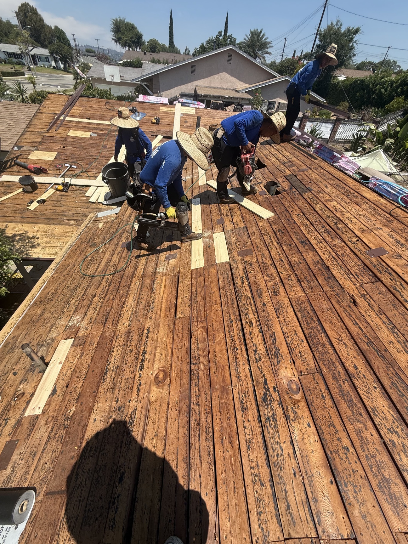 Direct Roofing crew replacing a residential roof in Los Angeles